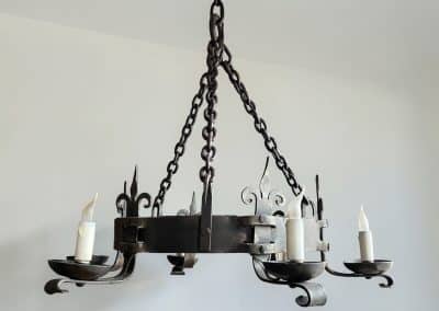 Pair of wrought iron chandeliers