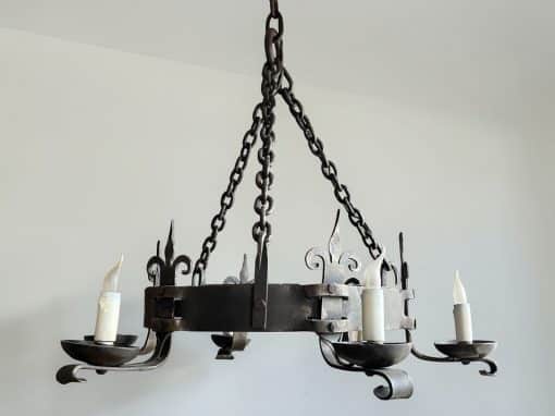 Pair of wrought iron chandeliers